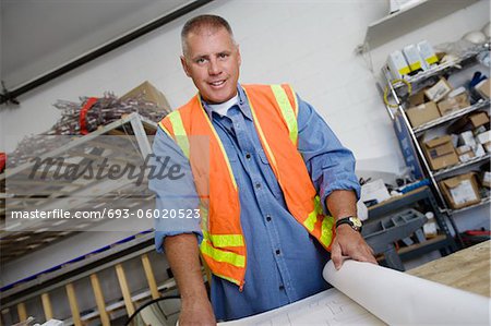 Workman Checking Building Plans