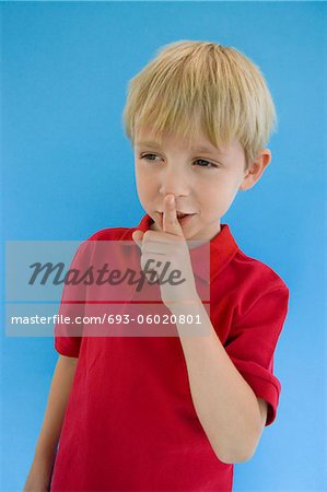 Boy with Finger on Lips