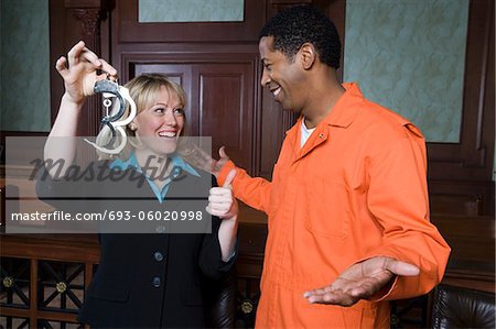Lawyer and client celebrating in court