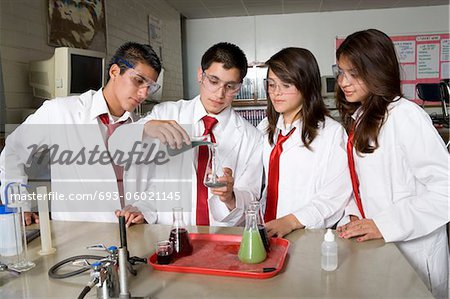 High School Students Conducting Science Experiment