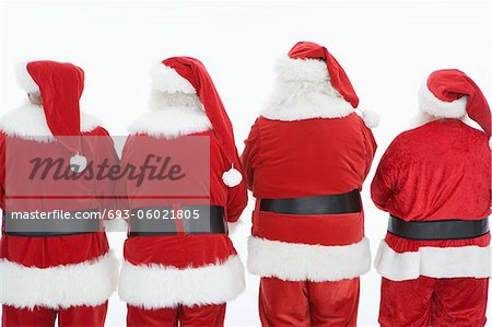 Group of men dressed as Santa Claus, rear view