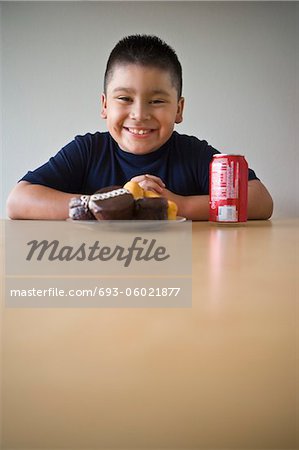 Portrait of pre-teen (10-12) boy about to eat dessert