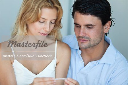 Couple looking at pregnancy test