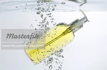 Soap dispenser submerged in water