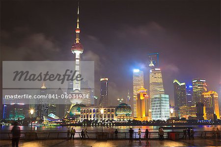 Pudong skyline at night across the Huangpu River, Oriental Pearl tower on left, Shanghai, China, Asia