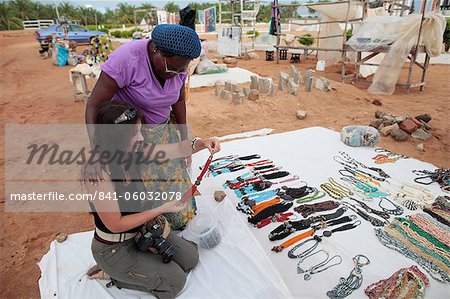 Woman buying souvenirs, Ouidah, Benin, West Africa, Africa