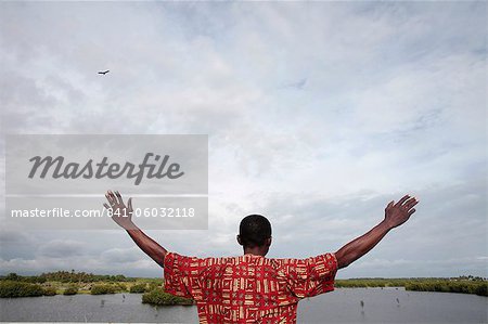 African man watching the sky, Ouidah, Benin, West Africa, Africa