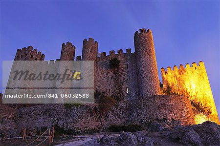 Obidos castle, today used as a luxury Pousada hotel, partially illuminated at night, Obidos, Estremadura, Portugal, Europe