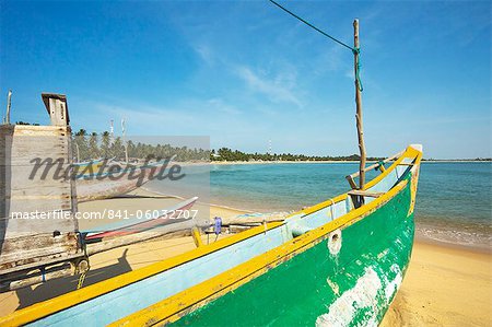 Outrigger fishing boats on this popular surf beach, badly hit by the 2004 tsunami, Arugam Bay, Eastern Province, Sri Lanka, Asia