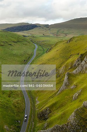 Cars travelling down Winnats Pass, Castleton, Peak District National Park, Derbyshire, England, United Kingdom, Europe