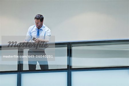 Businessman working on balcony