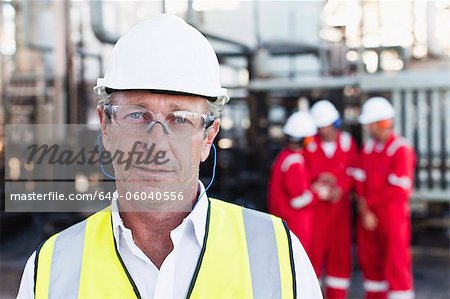 Worker standing at chemical plant