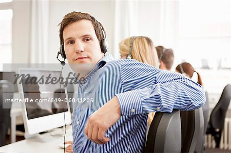 Business people working in headsets Business people working in headsets