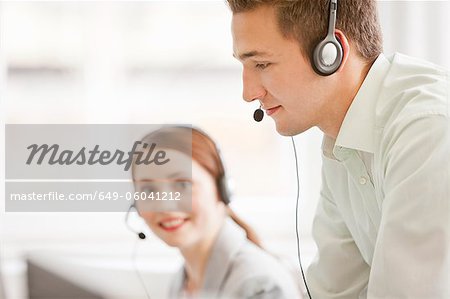 Business people working in headsets Business people working in headsets