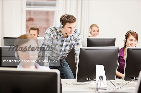 Business people working in headsets Business people working in headsets