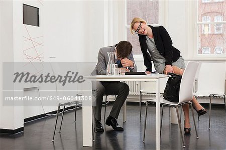 Business people laughing in office