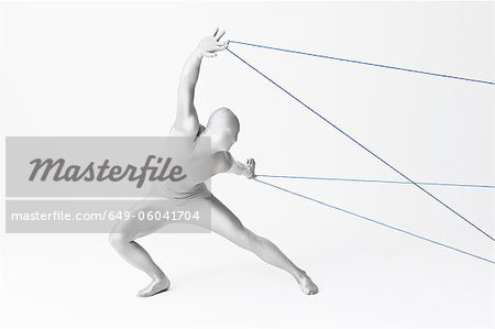 Man in bodysuit playing with string