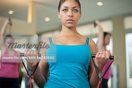 Woman stretching in gym