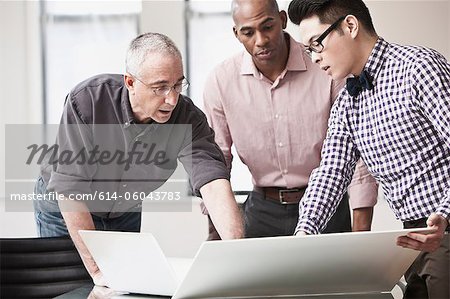 Three business people in meeting