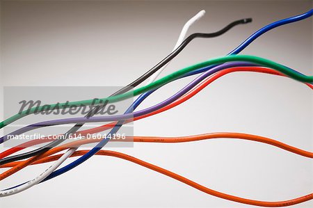 Close up of electrical wires against white background