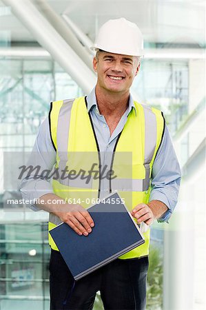 Portrait of engineer wearing hard hat in office