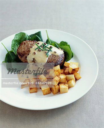 Grilled beef steak with mustard and pepper sauce, sauteed potatoes