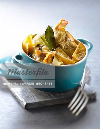 Casserole dish of rabbit with confit citrus,fennel and bay leaves