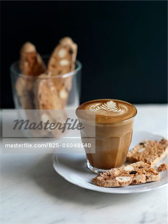 Foamy white coffee and crisp hazelnut bread