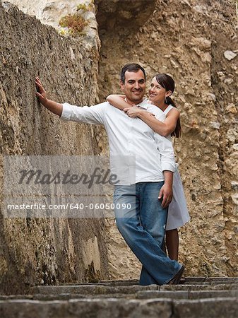 Italy, Ravello, Mature couple posing in narrow lane