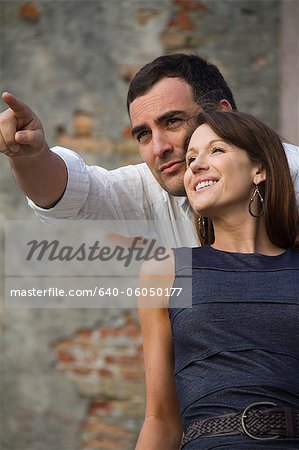 Italy, Venice, Mature couple looking away, man is pointing