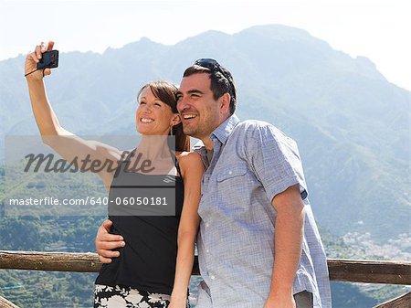 Italy, Amalfi Coast, Ravello, Smiling mature couple taking self photo