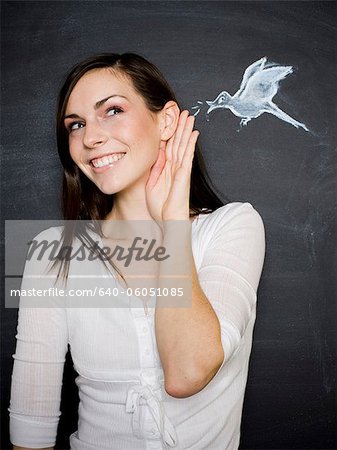 young woman against a chalkboard