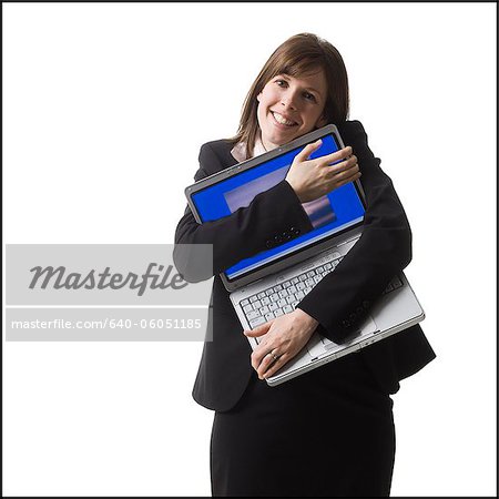 businessperson holding a laptop computer