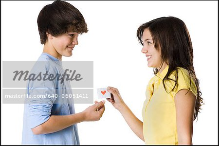 young couple passing a note