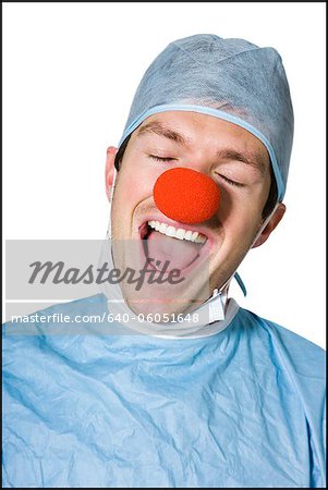 surgeon wearing a creepy clown nose
