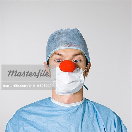 surgeon wearing a red clown nose