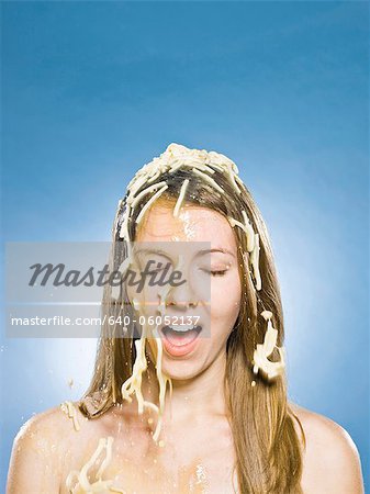 woman getting chicken noodle soup dumped on her head