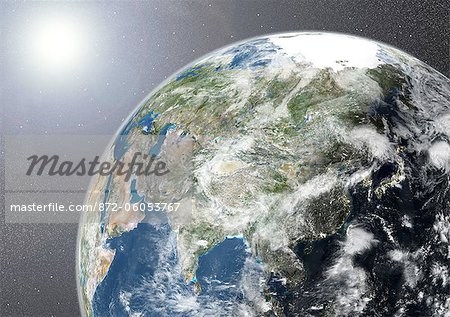 Globe Showing Asia, True Colour Satellite Image. True colour satellite image of the Earth showing Asia, half in shadow, with cloud coverage, and the sun. This image in orthographic projection was compiled from data acquired by LANDSAT 5 & 7 satellites.