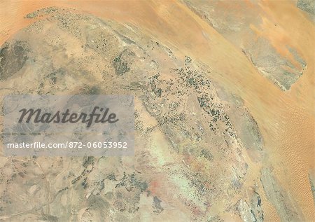 Agriculture In The Desert, Al-Qassim Province, Saudi Arabia, True Colour Satellite Image. True colour satellite image of agriculture in the desert, north of the Saudi cities of Buraydah and Unaizah (bottom right), in the Al-Qassim Province, Saudi Arabia. Circular agricultural plots are visible on the image. Composite image using LANDSAT 7 data.