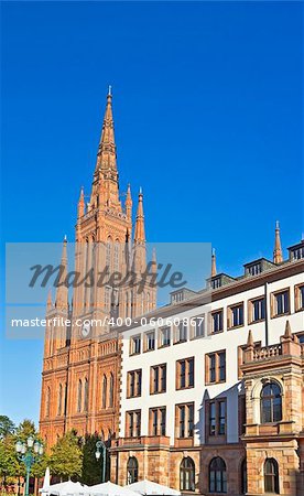 The Marktkirche's neo-Gothic steeple dominates the city hall of Wiesbaden, Hesse, Germany.