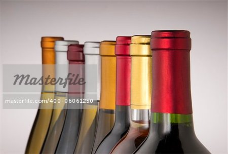 Wine bottle necks with limited depth of field on black