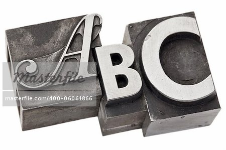 abc - first three alphabet letters in vintage letterpress metal type, isolated on white