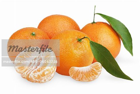 Ripe tangerines with leaves and slices isolated on white background