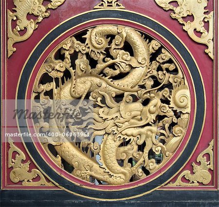 Wood Carving Chinese Dragon on Outside Temple Door with Bats Motif
