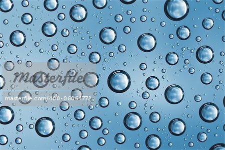 Abstract macro of water drops over blue background