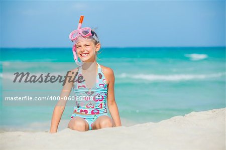 Portrait of a cute girl wearing a mask for diving background of the sea