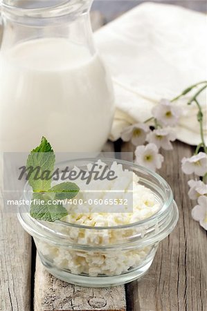 natural dairy product cottage cheese on a wooden table, rustic style