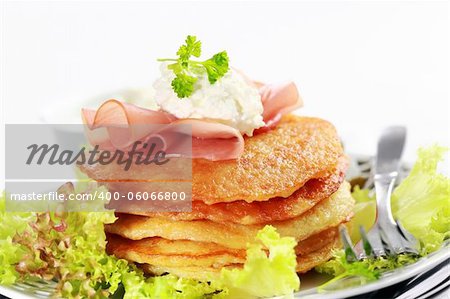 Delicious potato pancakes with curd cheese and herbs