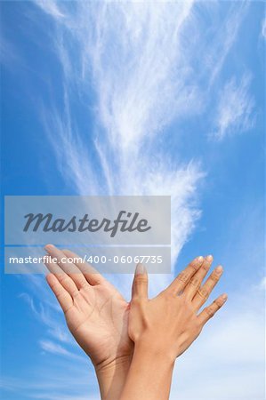 bird gesture by couple with cloud background