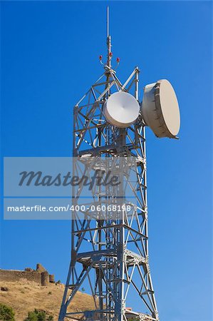Telecommunications tower at blue sky